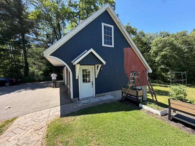 Garage side elevation with gray siding and white trim