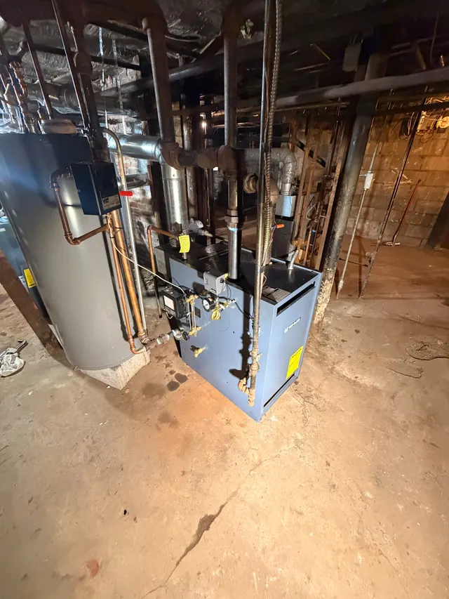 Renovation workspace with exposed framing and utilities