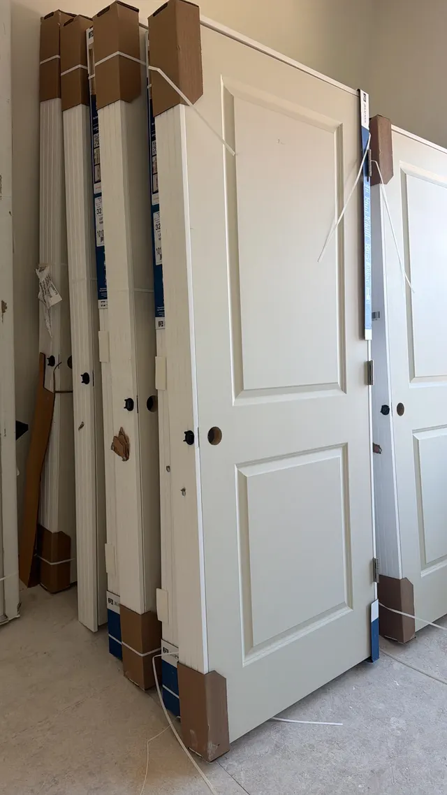 White interior trim and door beside an open room