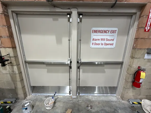 Interior commercial exit doors and adjacent wall finishes