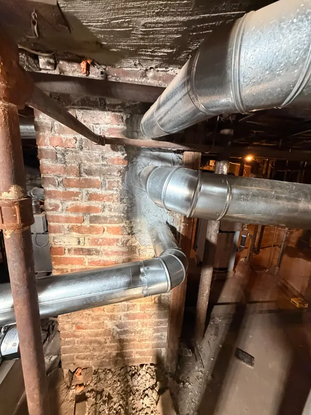 Ductwork, piping and exposed framing in a utility area
