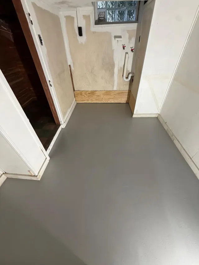 Interior hallway with gray flooring and light walls